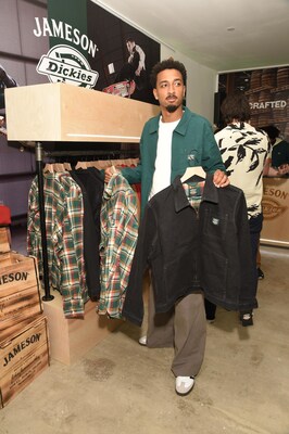 Travis Bennett shops the new limited-edition streetwear line ?Crafted Together' from Jameson and Dickies at the pop-up in New York, featuring signature pieces such as the iconic Dickies Eisenhower Jacket, overalls, beanies, tee-shirts, caps and more. Photo Credit: Michael Simon