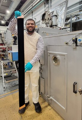 Abdul-Rahman Raji holds a copper foil coated with CNTs