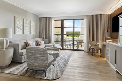 The redesign of the stunning Park View Deluxe Suites at Four Seasons Resort Orlando features light oak wide plank wood floors in the main living area, adorned with modern, neutral décor.