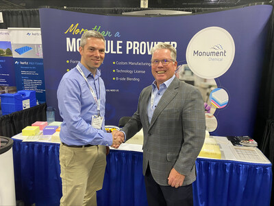 Econic Technologies Founder & Chief Technology Officer Mike Kember (left) and Monument Chemical Vice President & General Manager Don Phillips (right) shake hands at Foam Expo North America at exhibit 2702.