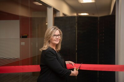 Sarah Scannell, Senior Engineering Director of 15.4 & Matter Software at Silicon Labs, cuts the ribbon to open the new Connectivity Lab at Silicon Labs Boston.