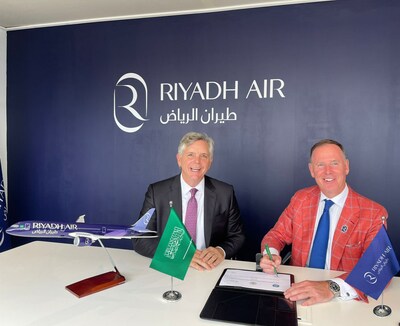 GE Chairman and CEO and GE Aerospace CEO Larry Culp (left), and Riyadh Air CEO Tony Douglas (right), sign agreement at Paris Air Show.