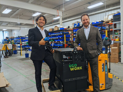 Rami Jarjour, COO and Philippe Beauchamp, CEO of UgoWork posing by a lithium-ion battery (CNW Group/UgoWork)