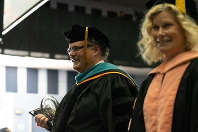 Loma Linda University named Inland Empire Health Plan's Chief Executive Officer Jarrod McNaughton, left, its 2023 Meritorious Service Award recipient during LLU's School of Public Health commencement ceremony, Friday, June 9, 2023.