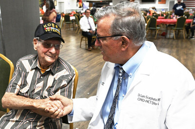 Dr. Len Scarpinato, Regional Chief Medical Officer, JenCare Senior Medical Centers, Louisiana, right, enjoys chatting with Korean War veteran Joe Barousse (USN, retired), during a special resource event for New Orleans veterans at VFW Post #3267.