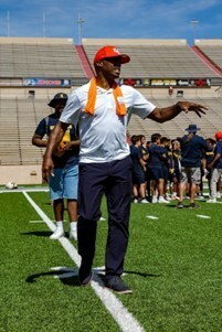 Darrell Green instructs defensive players on backward-running techniques.