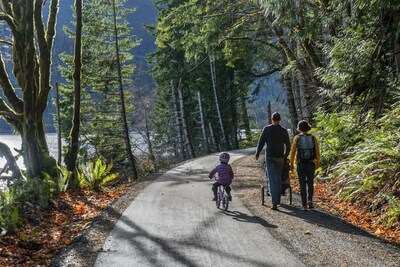 A family walks along a completed portion of the Olympic Discovery Trail, part of the cross-country Great American Rail-Trail on the Olympic Peninsula in Washington. The Olympic Discovery Trail is among dozens of trail and active transportation projects to receive funding from the 2023 USDOT RAISE grants. Photo by John Gussman, courtesy Rails-to-Trails Conservancy.