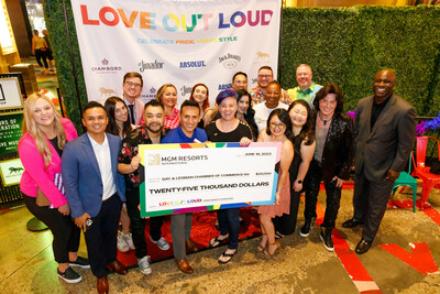 Representatives from the Nevada Gay and Lesbian Chamber and Commerce, MGM Resorts International and members of the community posing with the check.