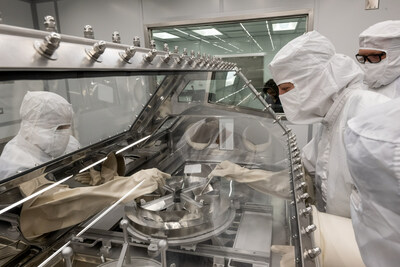 NASA's OSIRIS-REx curation team rehearse the opening of the asteroid sample canister in the newly built OSIRIS-REx Curation lab at Johnson Space Center.