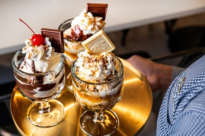 The Original Ghirardelli Chocolate & Ice Cream Shop will reopen on July 13 in San Francisco’s historic Ghirardelli Square and will feature North America’s largest flowing chocolate wall and Ghirardelli’s iconic hot fudge sundaes, pictured here. In honor of Ghirardelli’s 171-year chocolate history, the first 171 people in line to enter the store will receive a free Ghirardelli World Famous Hot Fudge Sundae. Photo Credit: Albert Law.