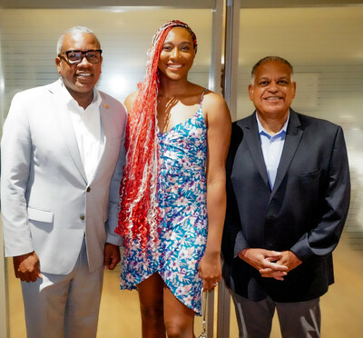 US Virgin Islands Governor Albert Bryan Jr. and Tourism Commissioner Joseph Boschulte celebrate with St. Thomas native and WNBA All-Star Aliyah Boston.