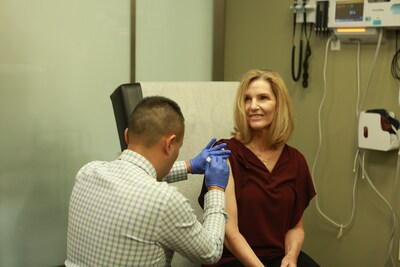Dr. Daniel Kwan, medical director of Dignity Health-GoHealth Urgent Care, administered what is believed to be the world's first FDA-approved RSV vaccination to Peggy Dracker.