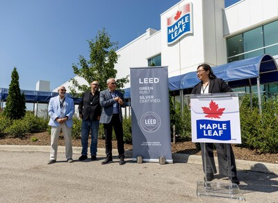 Deputy Mayor and Councillor (Ward 4) Tammy Hwang, speaking at Maple Leaf Foods' Heritage plant in Hamilton, Ontario today in celebration of the plant being awarded the Leadership in Energy and Environmental Design (LEED) Silver certification.

(Left to Right) Mark Tadeson, Councillor (Ward 11), Tom Sims, Maple Leaf Foods' Heritage Plant Manager, and Randy Huffman, Maple Leaf Foods’ Chief Food Safety and Sustainability Officer. (CNW Group/Maple Leaf Foods Inc.)