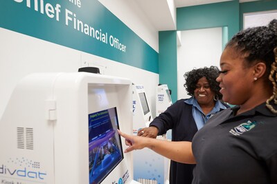 DivDat's Lead Ambassador, Brenda Ashford, assists with payments made on DivDat's Bill Payment Kiosks at the Detroit Taxpayer Service Center, located inside the Coleman A. Young Municipal Center, downtown.