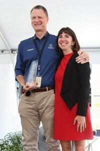 Garrett Dolan and Sadie Funk pose with the Best Place for Working Parents® National Innovator Award: Onsite Child Care presented to Tyson Foods at their new onsite child care center.