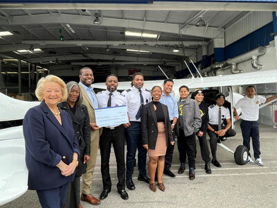Boeing leaders present a check to Fly Compton. Funds will go toward flight training classes offered to underserved students in LA’s Compton community. (photo: Fly Compton)