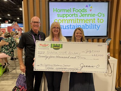 Members of Chicago’s Nicholson STEM Academy receive their <money>$25,000</money> check to be used for the purchase of new kitchen equipment and supplies. Matching checks were also given to Stillwater (Okla.) Middle School, Pine Line Elementary in Parker, Colo., and Kino Junior High in Mesa, Ariz.