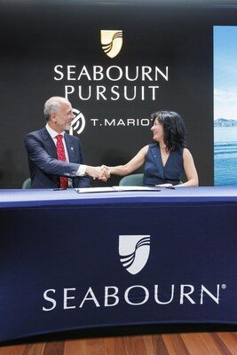 Natalya Leahy, president of Seabourn, and Marco Ghiglione, managing director, T. Mariotti Shipyard, sign documents to complete the delivery of Seabourn Pursuit, the line’s second ultra-luxury expedition ship.