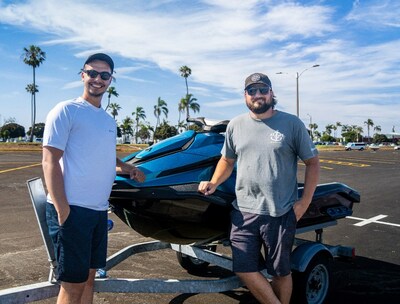 Philip Sudano, Delivery and Service Ops. Program Manager at Taiga Motors and Jeffrey Hughes, H&H Marine Owner (CNW Group/Taiga Motors Corporation)