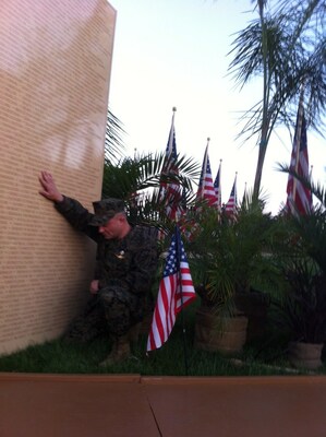 Chad Praying over his fallen brothers Foster and Robert's name on the War on Terror Memorial Wall