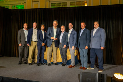 From left to right: Randy Ries (Senior Director of Sales, Tyson Foods Inc.), Rusty Covington (Director of East, Tyson Foods, Inc.), Arpen Shah (VP, Merchandising Strategy and Analytics, SpartanNash), Mark Van Ryne (Customer Development Manager, Tyson Foods, Inc.), Tony Sarsam (CEO, SpartanNash), Bennett Morgan (SVP and Chief Merchandising Officer, SpartanNash), Tim Kent (Director, Meat/Seafood Merchandising, SpartanNash), Mike Van Drie (Manager, Category - MDSE Meat, SpartanNash)