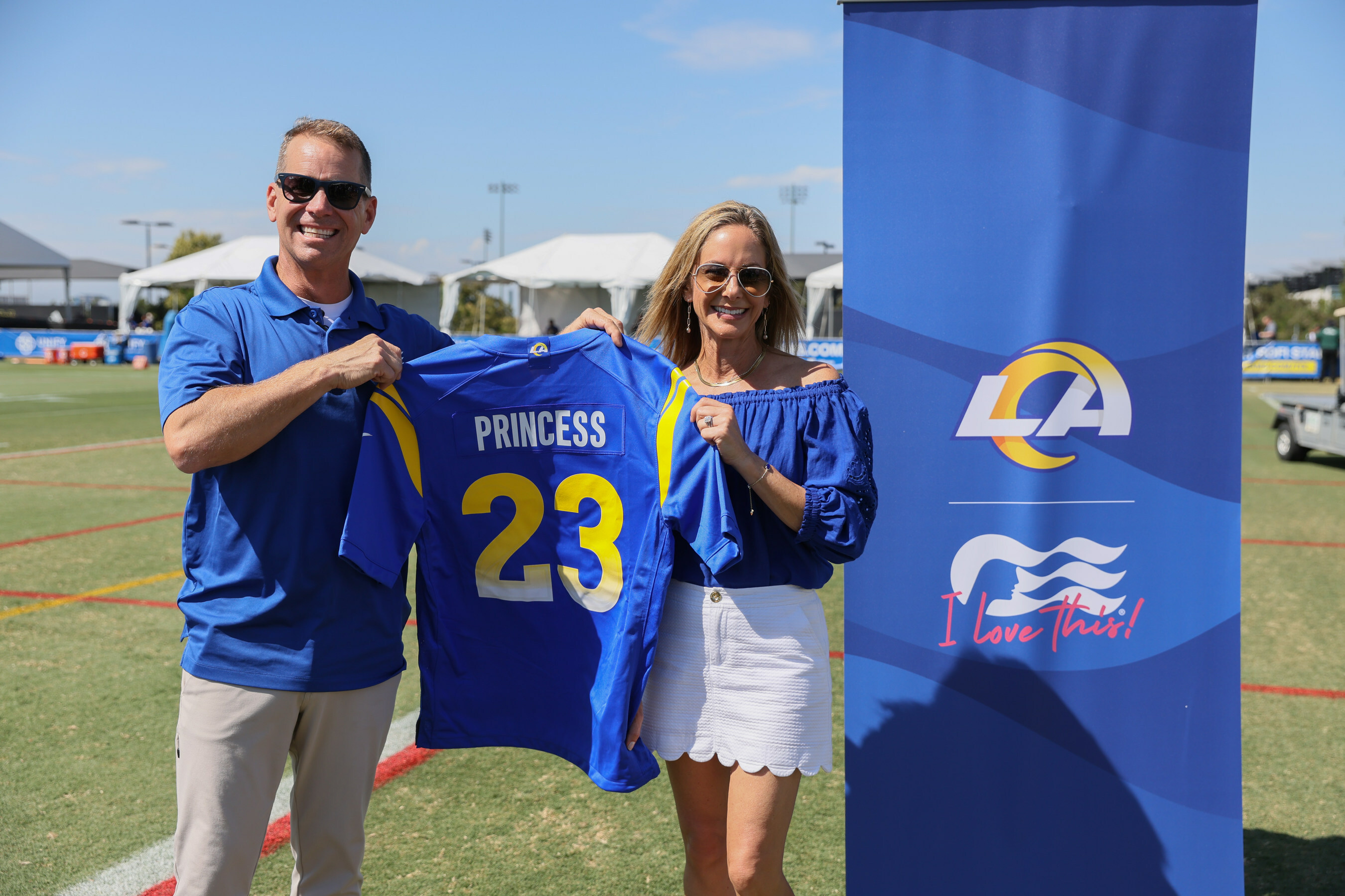 John Padgett, Princess Cruises President (left) and Jennifer Prince, Chief Commercial Officer for the Los Angeles Rams (right) pose together at the LA Rams Training Camp  (Image at LateCruiseNews.com - August 2023)