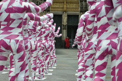 Copyright: Ricarda Reich / 333 children mannequins wrapped in purple an white barricade taple placed in front of the Cologne Cathedral, installed there by German artist Dennis Josef Meseg, called "Shattered Souls - in a Sea of Silence", to protest against the abuse scandals in the Catholic Church in Cologne, Germany.