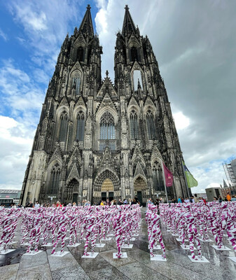 Copyright: Ricarda Reich / 333 children mannequins wrapped in purple an white barricade taple placed in front of the Cologne Cathedral, installed there by German artist Dennis Josef Meseg, called "Shattered Souls - in a Sea of Silence", to protest against the abuse scandals in the Catholic Church in Cologne, Germany.