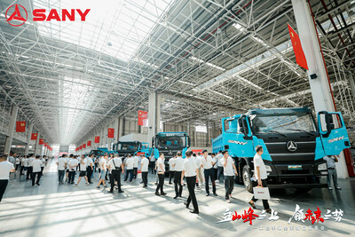 Clients check out the new energy vehicles newly launched by SANY in its industrial park in Changsha. (PRNewsfoto/SANY Group)
