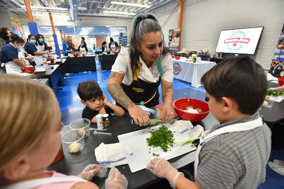Danielle Duran Zecca, chef and co-founder of Amiga Amore, hosts a cooking class at the Boys & Girls Club of Hollywood, showing members how to make her Albondigas Sope recipe featuring Farmer John Premium Mild Pork Sausage Roll