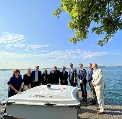 PortsToronto leadership and partners gather to celebrate the launch of the WasteSharks as part of PortsToronto's network of trash trapping devices. (CNW Group/PortsToronto)