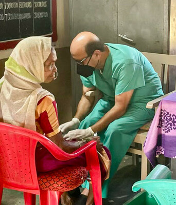 Barton Associates' 2023 Locum Hero Dr. Alok Gupta (right) treats a patient.