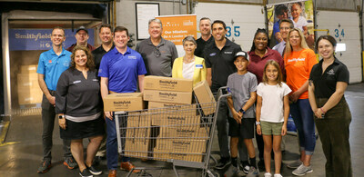 Representatives from Smithfield Foods and Kroger join together to donate 30,000 pounds of protein to Gleaners Food Bank of Indianapolis.