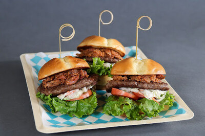 Drift Bar's Beef Burger & Pulled Pork Sliders featuring beef patties topped with pulled pork, BBQ sauce, lettuce and tomato on toasted potato buns