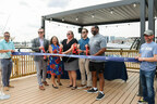 Opening new horizons with a ceremonial snip -- MMG execs & civic leaders celebrate the beginning of a remarkable journey
