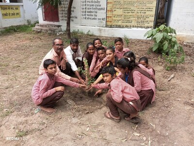 Children planting saplings at a school in Uttar Pradesh under the 'Ek pedh balika shiksha ke liye' initiative (PRNewsfoto/Educate Girls)