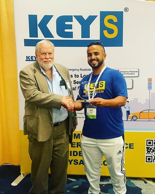 ALOA President Bill Mandlebaum, left, presents the 2023 Best New Product award to Loay Jamal Alyousfi of Keys Inc. for his company's Keys App.