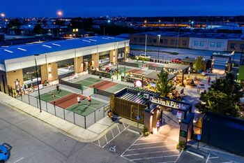 Chicken N Pickle is the original indoor/outdoor “eatertainment” complex with a casual, chef-driven restaurant, sports bar, pickleball courts and a variety of yard games.