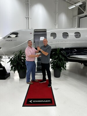 Rickey Oswald and Christopher B. Munday take delivery of N111CM.