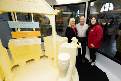 “Dairy Every Day is a Healthy Way – Keeping Kids’ Health on Track”  is this year's theme of the 55th Annual Butter Sculpture at the New York State Fair, unveiled by American Dairy Association North East on August 22. Pictured from left to right:  Dairy farmer and American Dairy Association North East Board President Audrey Donahoe, New York State Department of Agriculture and Markets Commissioner Richard A. Ball and New York State Dairy Ambassador Arianna Aman