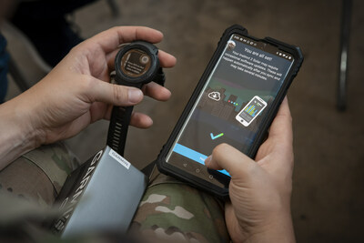 A U.S. Space Force Guardian syncs data from a smartwatch to a phone during a Continuous Fitness Assessment, or CFA, study informational session hosted by an Air Force Research Laboratory team at a facility near Wright-Patterson Air Force Base, Ohio, June 8, 2023. 
Photo credit: U.S. Space Force / Rick Eldridge