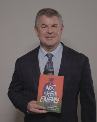 Author Robert Wolf with award-winning book Not a Real Enemy (PRNewsfoto/Living Now Book Awards)