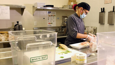 Chef Finnigan preps afternoon lunch in the SPX FLOW Marketplace cafeteria, collecting residential scraps for composting.