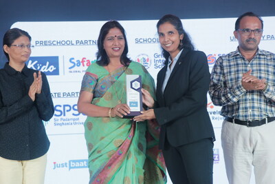 Arpita Sur, CEO, Kido India, receiving the Leading Preschool of India Award from the Jury members.