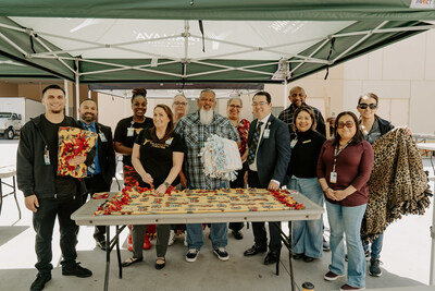 Team members make knot-blankets during National Volunteer Month. The blankets supported the Children's Assessment Center in San Bernardino and are given to children who were removed from their homes.