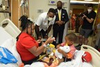 Pro Football Hall of Famer Calvin "Megatron" Johnson Jr. Visits Children and Families at the Aflac Cancer and Blood Disorders Center at Children's Healthcare of Atlanta