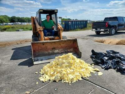 Jack Klapper, co-owner of Noblehurst Farms in Livingston County (N.Y.) prepares to move 800 pounds of butter into the farm's methane digester.