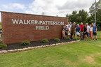 Walker and Patterson families next to newly dedicated Walker-Patterson field