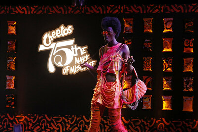Cheetos-inspired outfits that embody Chester Cheetah’s playful and mischievous energy hit the runway at “Cheetos 75th: The Mark of Mischief” ahead of fashion’s biggest week