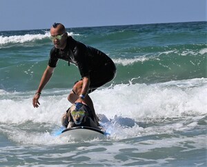 SURFING PUPS MAKE A SPLASH AT 18TH ANNUAL SURF DOG SURF-A-THON